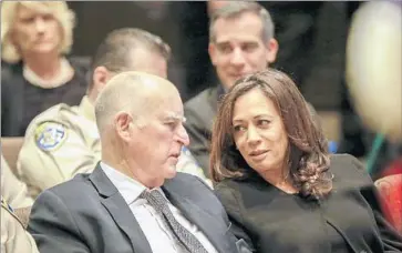  ?? Irfan Khan Los Angeles Times ?? GOV. JERRY BROWN, left, chats with Atty. Gen. Kamala Harris. It’s unclear when Harris would resign her current position should she be elected — new U.S. senators don’t take office until January.
