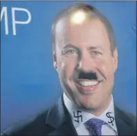  ??  ?? Posters of MPs Josh Frydenberg and Julian Leeser were defaced; a 2017 ceremony attended by Jewish MPs to launch Australia’s first Torah written in parliament