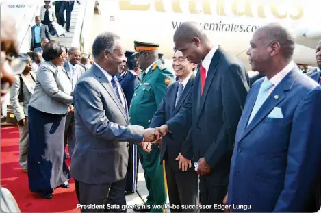  ??  ?? President Sata greets his would-be successor Edger Lungu