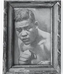  ?? COURTESY OF BRIAN MATNEY ?? Brian Matney of Virginia Beach paid about 80 cents for this framed newspaper photo clipping of heavyweigh­t boxing legend Joe Louis.