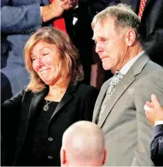  ?? — Reuters photo ?? File photo shows Otto Warmbier’s parents Fred and Cindy Warmbier cry as US President Donald Trump talks about the death of their son after his arrest in North Korea during the State of the Union address.