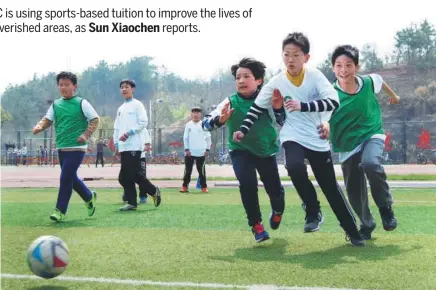  ?? PHOTOS BY SUN XIAOCHEN / CHINA DAILY ?? Students at Siyuan Experiment­al School in Jinzhai county, western Anhui province, compete in a soccer game during a PE class.