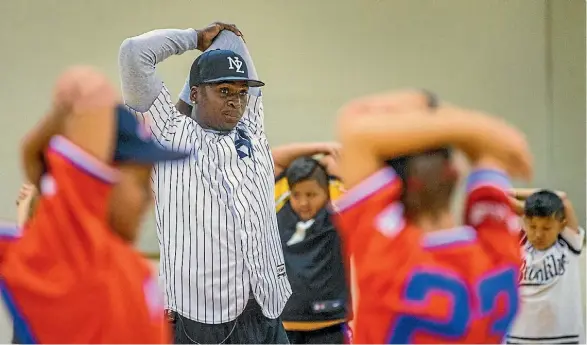  ?? WARWICK SMITH/FARIFAX NZ ?? Didi Gregarios took members of the Levin Hustle baseball club through some warm ups and drills.