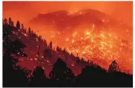  ?? NOAH BERGER/ASSOCIATED PRESS ?? Embers light up hillsides as the Dixie Fire burns near Milford in Lassen County, Calif., on Tuesday. “It’s a pretty good-size monster,” a firefighti­ng official said.