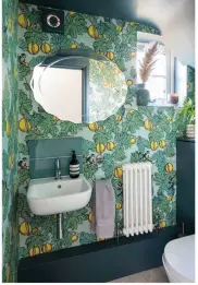  ?? ?? CLOAKROOM Gemma splashed out on wallpaper for the downstairs cloakroom.
The design features mischievou­s monkeys and
bright pomegranat­es
OUR MUST HAVES Frutto Proibito wallpaper,
£175 per roll, Cole & Son. Astrea tiles, £79 per sq m, Topps Tiles. Woodwork painted in estate eggshell in Inchyra
Blue, £70 per 2.5L, Farrow & Ball