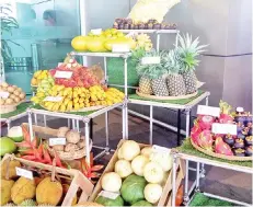  ??  ?? Some of the local fruits displayed for tourists at the airport.