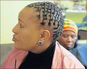  ??  ?? TURNING HEADS: Dreadlock convert Noli Kaptein has ditched hairstraig­htening for styles like this one, in which Cembi coiled her shoulderle­ngth dreadlocks into this elegant shape close to her head