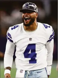  ?? Tom Pennington / Getty Images ?? Cowboys QB Dak Prescott celebrates a Dallas intercepti­on during a preseason game against the Seahawks on Friday.