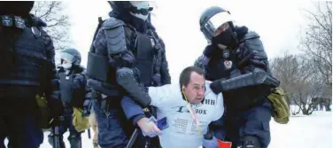  ?? Associated Press ?? Police detain a man during a protest against the jailing of Alexei Navalny in St. Petersburg on Saturday.