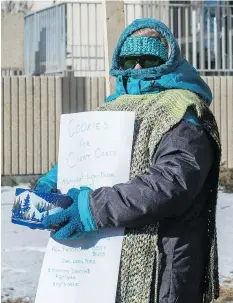  ?? BRANDON HARDER ?? A woman, who would only give the name Marie, hands out cookies containing marijuana purchased at Best Buds Society.