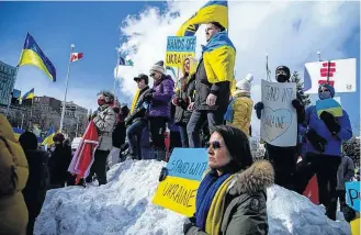  ?? ASHLEY FRASER • POSTMEDIA NEWS ?? A large group of people gathered outside the Russian Embassy in Sandy Hill, Ottawa on Feb. 27 to stand united with Ukrainians and protest the Russia invasion of Ukraine.