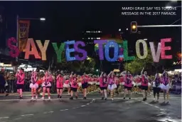  ??  ?? MARDI GRAS’ SAY YES TO LOVE MESSAGE IN THE 2017 PARADE.