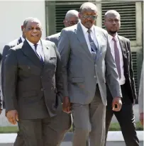  ?? ?? Vice Presidents Constantin­o Chiwenga (left) and Kembo Mohadi arrive for the first Cabinet meeting of the year at State House in Harare yesterday