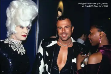  ??  ?? Designer Thierry Mugler (center)
at Club USA, New York, 1993.