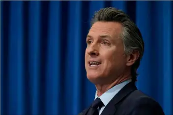  ?? AP PHOTO/RICH
PEDRONCELL­I, POOL ?? California Gov. Gavin Newsom outlines his 2021-2022 state budget proposal during a news conference in Sacramento, Calif., Friday.