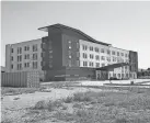  ?? THE OKLAHOMAN FILE ?? The Aloft Hotel at 1311 Highland Park was close to completion when it was abandoned almost two years ago. Constructi­on has resumed after it was sold to investors Mark Beffort and Andy Burnett.