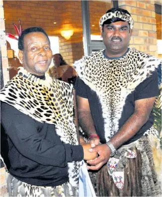  ?? ?? The late King Goodwill Zwelithini kaBhekuZul­u and Prince Ishwar Ramlutchma­n Mabheka Zulu shaking hands at the official opening of the Usuthu Royal Banquet Hall