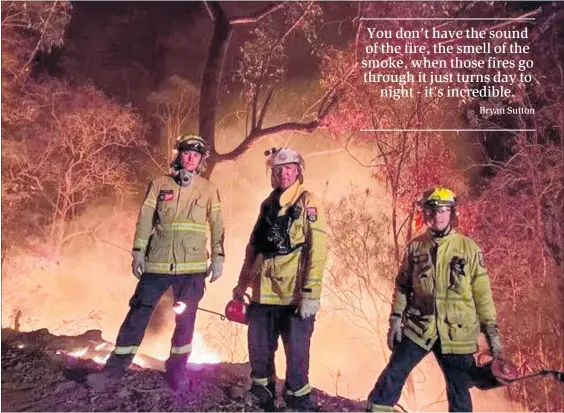  ??  ?? Bryan Sutton, centre, during a back burning operation in Boonah.