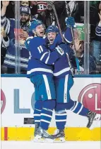  ?? CHRIS YOUNG THE CANADIAN PRESS ?? Zach Hyman, left, helps rookie Andreas Johnsson celebrate after the rookie scored his first NHL goal and his team’s fourth against the Montreal Canadiens.