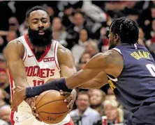  ?? Matthew Stockman / Getty Images ?? The Nuggets tried to force the ball out of James Harden’s hands. His 27 points were his second-lowest total of the season.