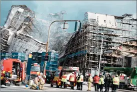  ?? Picture: Thomas Traasdahl/ritzau Scanpix via AP ?? The havoc wreaked by a fire which raged through one of Copenhagen’s oldest buildings on Tuesday, causing the collapse of the iconic spire of the 17th-century Old Stock Exchange as passersby rushed to help emergency services save priceless paintings and other valuables