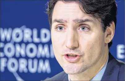  ?? CP PHOTO ?? Prime Minister Justin Trudeau responds to a question during the closing news conference at the World Economic Forum Thursday in Davos, Switzerlan­d.