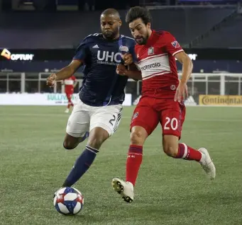  ?? BOSTON HERALD FILE ?? ALWAYS THERE: Revolution defender Andrew Farrell, left, looks to defend against Chicago Fire midfielder Nicolas Gaitan in 2019. Farrell is set to make his 250th MLS appearance, all with the Revs, when they take on FC Dallas tonight.