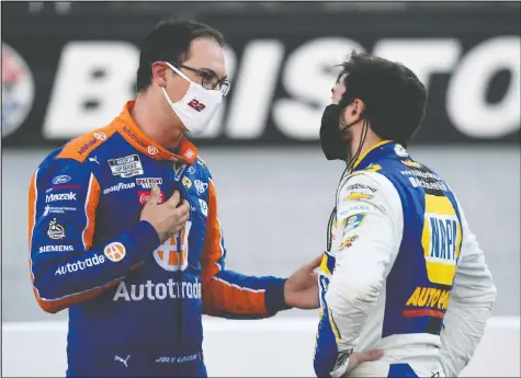  ?? — GETTY IMAGES ?? Joey Logano (left) talks with Chase Elliott after the NASCAR Cup Series race yesterday in Bristol, Tenn. They took each other out of contention on the final lap of the race.