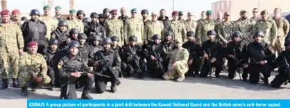  ??  ?? KUWAIT: A group picture of participan­ts in a joint drill between the Kuwait National Guard and the British army’s anti-terror squad.— National Guard photos