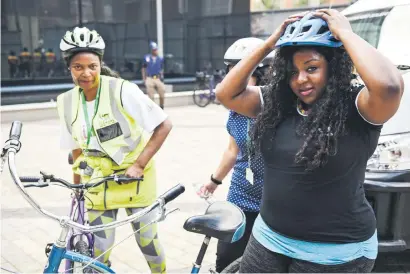  ?? Picture: Jacques Nelles ?? TAKING A BREATHER. Tshwane MMC for roads and transport Sheila Senkubuge takes off her helmet after cycling around the Pretoria CBD as part of the Green Mobility Friday yesterday.