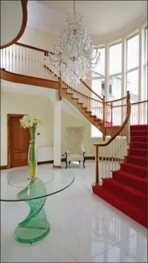  ??  ?? Going up in the world: White marble flooring leads to a grand staircase