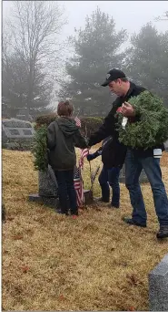  ?? LAUREN A. LITTLE — MEDIANEWS GROUP ?? At Boyertown’s Fairview Cemetery, volunteers lay wreaths and remember veterans.