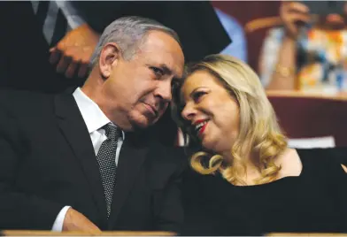  ?? (Amir Cohen/Reuters) ?? A COUPLE in the eye of a storm. Investigat­ions into both Prime Minister Benjamin Netanyahu and his wife, Sara, mounted yesterday.