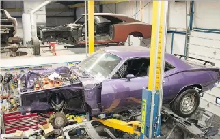  ?? CLAYTON SEAMS/DRIVING ?? Jeff Cabot’s restoratio­n shop specialize­s in Mopar muscle cars — and includes runs and paint drips the cars had when new.