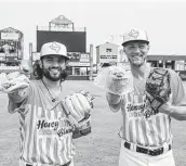  ?? Courtesy Corpus Christi Hooks ?? C.J. Hinojosa, left, and Grae Kessinger model the Corpus Christi Hooks’ Honey Butter Chicken Biscuits uniforms.