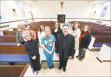  ?? Arnold Gold / Hearst Connecticu­t Media ?? A group of parishione­rs from St. George Roman Catholic Church in Guilford who took part in a mission to Haiti. They include, front row from left, Marge O’Donnell, Susie Kesselring and the Rev. Stephen Sledesky. Back row: Claire Nicholls, Andrea Ring,...