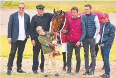  ?? Picture: GETTY ?? Jockey Corey Brown, trainer Joseph O'Brien and part-owners Nick Williams, Lloyd Williams and his grandson Frank Williams pose with Melbourne Cup winner Rekindling yesterday.