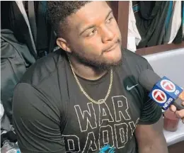  ?? OMAR KELLY/STAFF ?? Dolphins offensive lineman Jermon Bushrod wears a “War Daddy” T-shirt that has become a badge of honor among Dolphins players.