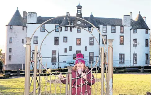  ??  ?? PETITION: Frances Smith of Friends of Dudhope Castle outside the Dundee landmark. Picture by Gareth Jennings.