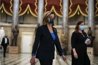  ?? Photograph: Bloomberg/Getty Images ?? Nancy Pelosi walks from her office to the House floor at the Capitol on Tuesday.