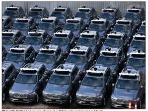  ?? (AP file photo) ?? Uber self-driving Volvos are stored at a Pittsburgh parking lot in March.