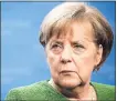  ?? DARIO PIGNATELLI — BLOOMBERG ?? German Chancellor Angela Merkel backed down and reached a compromise agreement on immigratio­n with hard-line coalition allies.