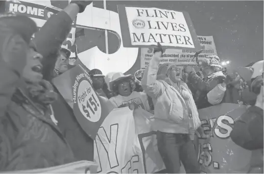  ?? SALWAN GEORGES, DETROIT FREE PRESS, VIA USA TODAY NETWORK ?? Protesters demonstrat­e before a Republican presidenti­al debate Thursday in Detroit outside the Fox Theatre.