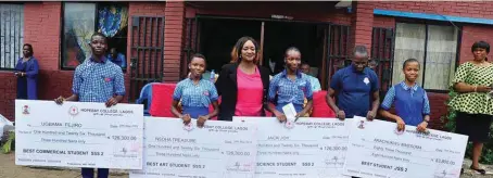  ??  ?? The Chief Executive Officer, Hope Bay College, Lagos, Miss Jumoke Oladapo (third left); the Principal, Mr. Joseph Okedu (second right), with beneficiar­ies of scholarshi­p awarded by the 1998 set of old students