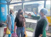  ??  ?? Health workers checking the body temperatur­e of passengers boarding a bus in Shimla on Monday. DEEPAK SANSTA /HT