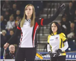  ?? The Canadian Press ?? Ontario skip Rachel Homan calls the delivery as Manitoba skip Michelle Englot looks on during the Page Playoff at the Scotties Tournament of Hearts in St. Catharines, Ont., on Friday. Manitoba won 9-8.