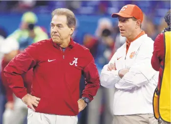  ?? GERALD HERBERT/AP FILE PHOTO ?? Alabama, coached by Nick Saban (left), is set to take on Dabo Swinney's Clemson squad for the fourth straight year in Monday night's College Football Playoff title game.