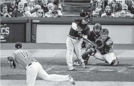  ?? Yi-Chin Lee / Staff photograph­er ?? Red Sox third baseman Rafael Devers hits the second grand slam of the night in the second inning of Game 2 of the ALCS against the Astros on Saturday.