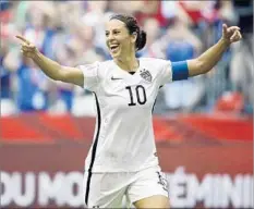  ?? Elaine Thompson Associated Press ?? U.S. WOMEN’S National Team player Carli Lloyd celebrates scoring her third goal against Japan in the final of the 2015 World Cup.