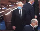  ?? POOL VIA GETTY IMAGES ?? Senate Majority Leader Mitch McConnell arrives for the Electoral College vote certificat­ion for President-elect Joe Biden, during a joint session of Congress at the U.S. Capitol on Wednesday in Washington, DC.